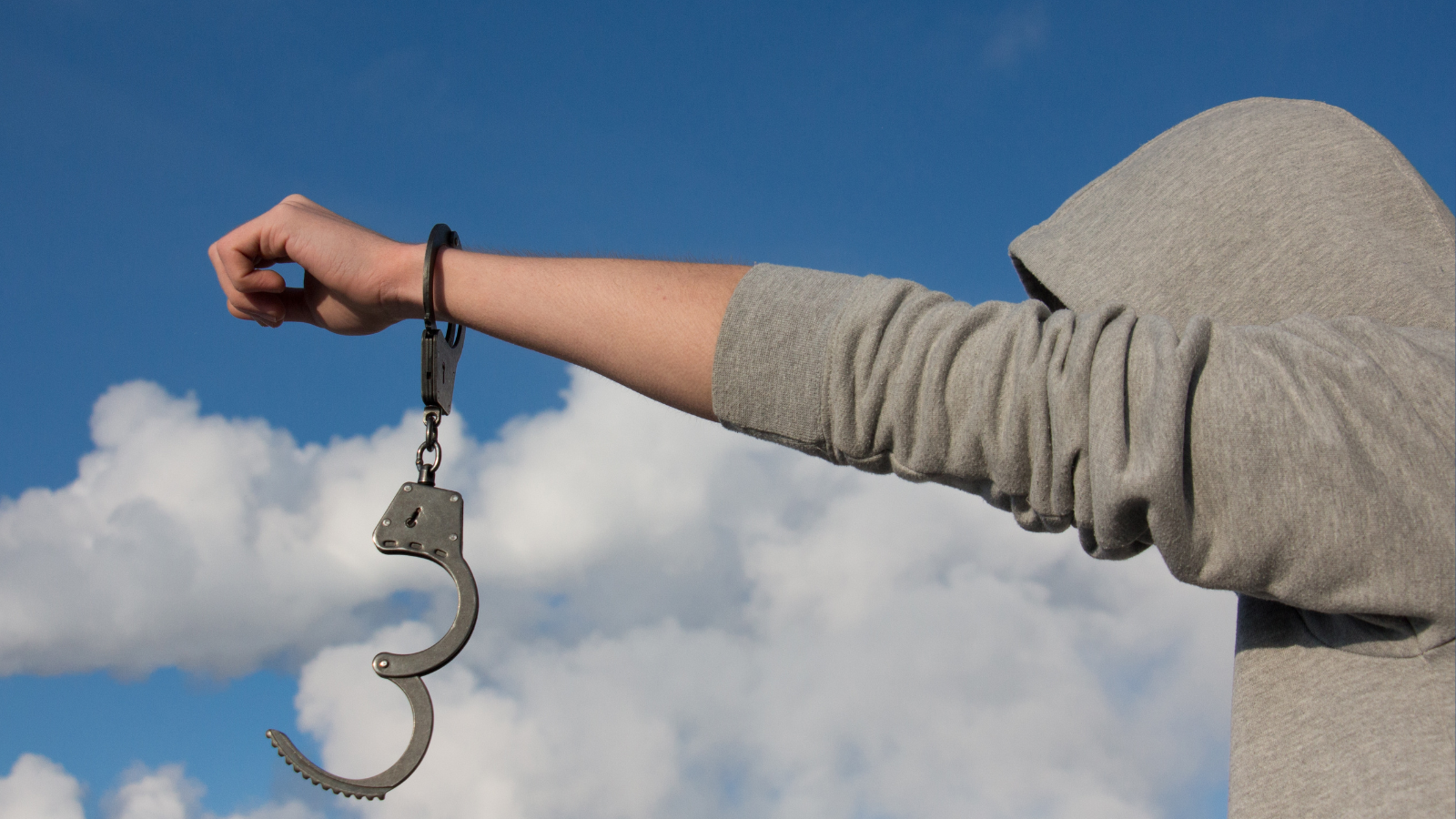 Kids wearing a hoodie and handcuffs